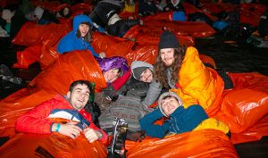 Photo of sleep out participants in sleeping bags